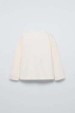 Niños ZARA 1½ - 6 Años·Camisetas|1½ - 6 Años·Licencias<CAMISETA FLOCK HELLO KITTY ©