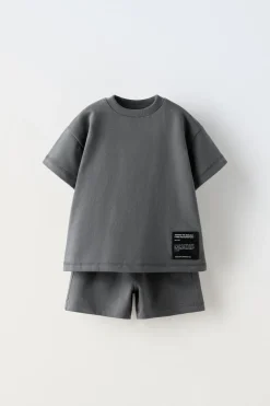 Niños ZARA 1½ - 6 Años·Camisetas|1½ - 6 Años·Pantalones / Leggings<CONJUNTO FELPA CAMISETA Y BERMUDA ETIQUETA