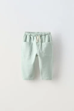 Niños ZARA 6 - 18 Meses·Pantalones / Leggings<PANTALÓN LISO BOLSILLOS