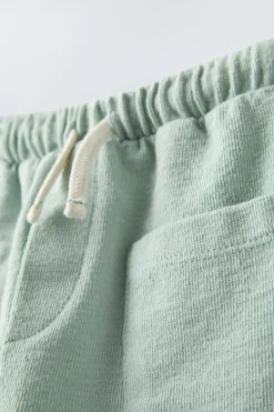 Niños ZARA 6 - 18 Meses·Pantalones / Leggings<PANTALÓN LISO BOLSILLOS