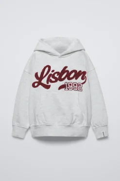 Niños ZARA 6 - 14 Años·Sudaderas<SUDADERA CAPUCHA TEXTO RIZO